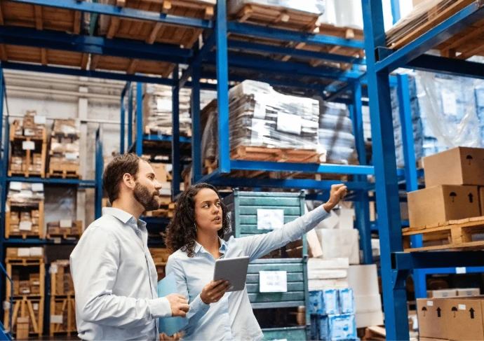 Team reviewing inventory in warehouse